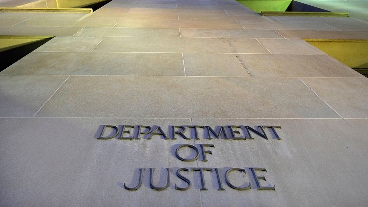 This May 14, 2013, file photo shows the Department of Justice headquarters building in Washington early in the morning. (AP Photo/J. David Ake, File)