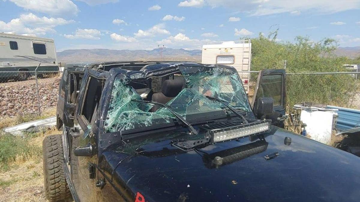 An Arizona couple was lucky to be alive after their Jeep careened off an 80-foot cliff.