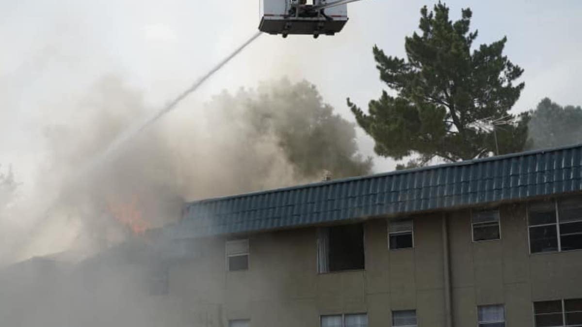 A construction worker helped save a two-month-old girl and a young boy after a fire broke out on Friday, according to a report. 