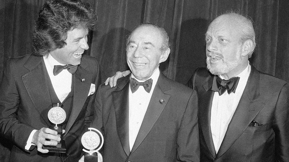 FILE - In this June 4, 1979 file photo, Jack Hofsiss, left, and Hal Prince, right, flank Richard Rodgers at the Tony Award presentations in New York. Prince, who pushed the boundaries of musical theater with such groundbreaking shows as “The Phantom of the Oepra,”
