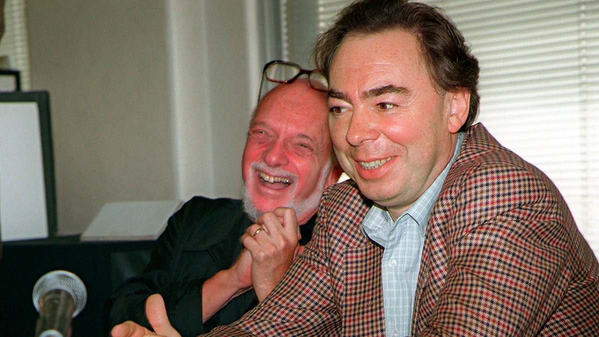 This Oct. 21, 1996 file photo shows Harold Prince, left, and Andrew Lloyd Webber, face reporters during a news conference in New York announcing Webber's new musical,