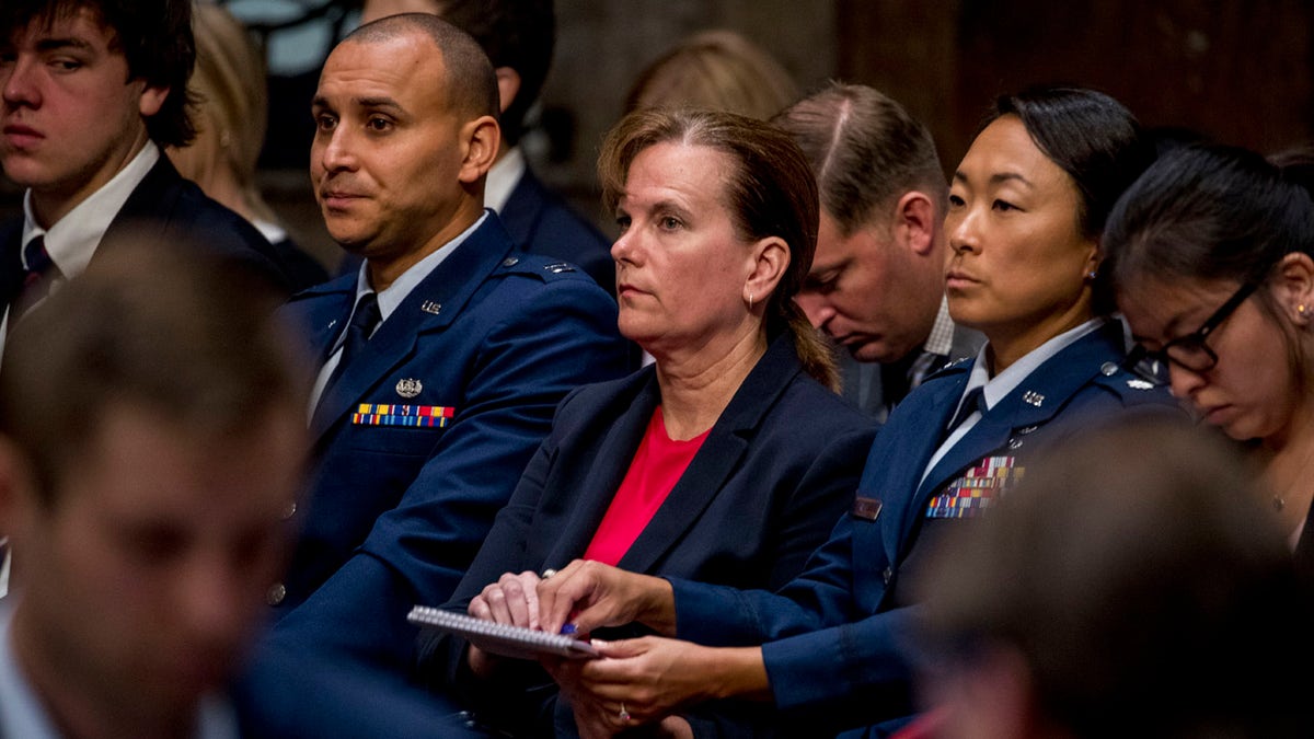 Former aide Army Col. Kathryn Spletstoser sits in the audience as Gen. John Hyten appears before the Senate Armed Services Committee on Capitol Hill in Washington, Tuesday, July 30, 2019, for his confirmation hearing to be Vice Chairman of the Joint Chiefs of Staff.