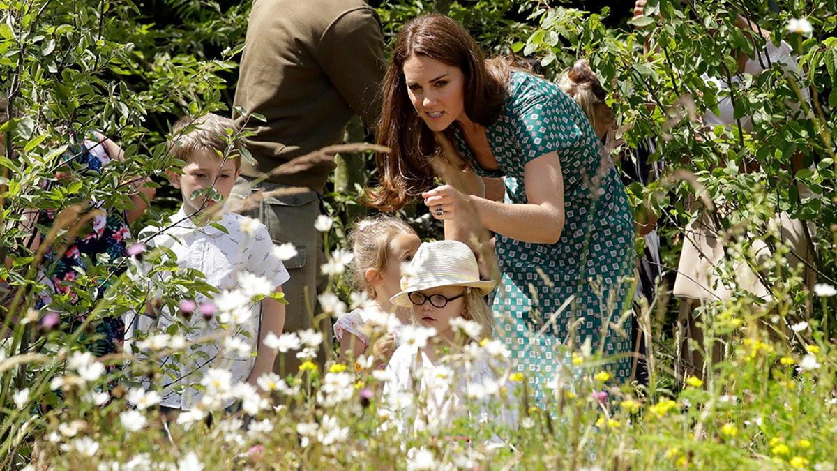 Britain's Kate, the Duchess of Cambridge, visits her "Back to Nature" show garden during the press day for Hampton Court Palace Garden Festival in East Molesey, London, July 1, 2019. (AP)