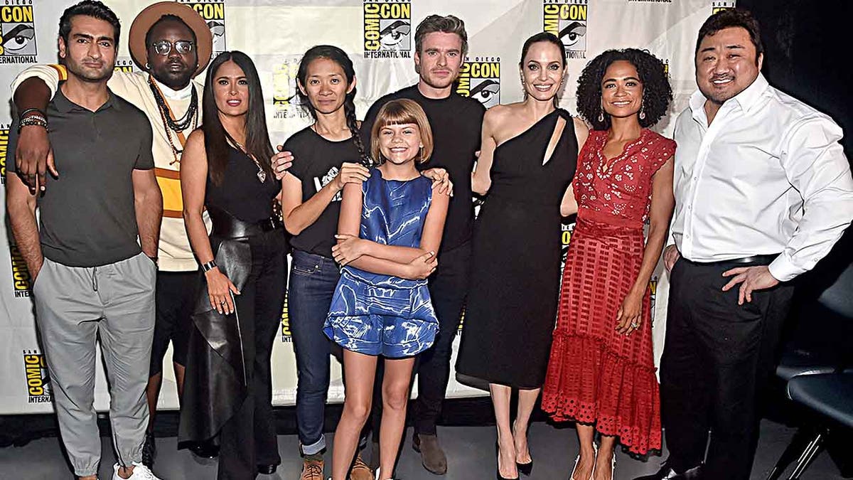 SAN DIEGO, CALIFORNIA - JULY 20: (L-R) Kumail Nanjiani, Brian Tyree Henry, Salma Hayek, Director Chloe Zhao, Lia McHugh, Richard Madden, Angelina Jolie, Lauren Ridloff and Don Lee of Marvel Studios' 'The Eternals' at the San Diego Comic-Con International 2019 Marvel Studios Panel in Hall H on July 20, 2019 in San Diego, California. (Photo by Alberto E. Rodriguez/Getty Images for Disney)