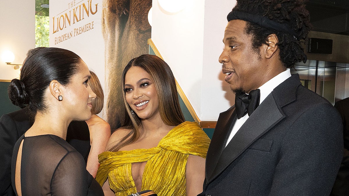 Britain's Meghan, Duchess of Sussex (L) meets cast and crew, including US singer-songwriter Beyoncé (C) and her husband, US rapper Jay-Z (R) as she attends the European premiere of the film The Lion King in London on July 14, 2019. (Photo by Niklas HALLE'N / POOL / AFP) (Photo credit should read NIKLAS HALLE'N/AFP/Getty Images)