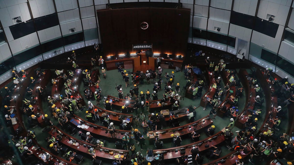 Protesters gather inside the meeting hall of the Legislative Council in Hong Kong, Monday, July 1, 2019.