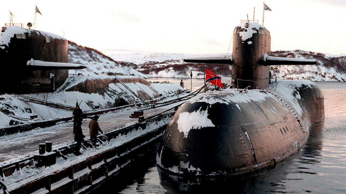 FILE - In this file photo taken on Thursday, Jan. 1, 1998, Decommissioned Russian nuclear submarines are shown in their Arctic base of Severomorsk, the Kola Peninsula, Russia. (AP Photo)
