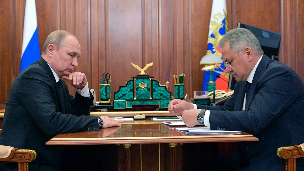 Russian President Vladimir Putin listens to Russian Defense Minister Sergei Shoigu during their meeting in the Kremlin in Moscow, Russia, Tuesday, July 2, 2019. (Alexei Druzhinin, Sputnik, Kremlin Pool Photo via AP)