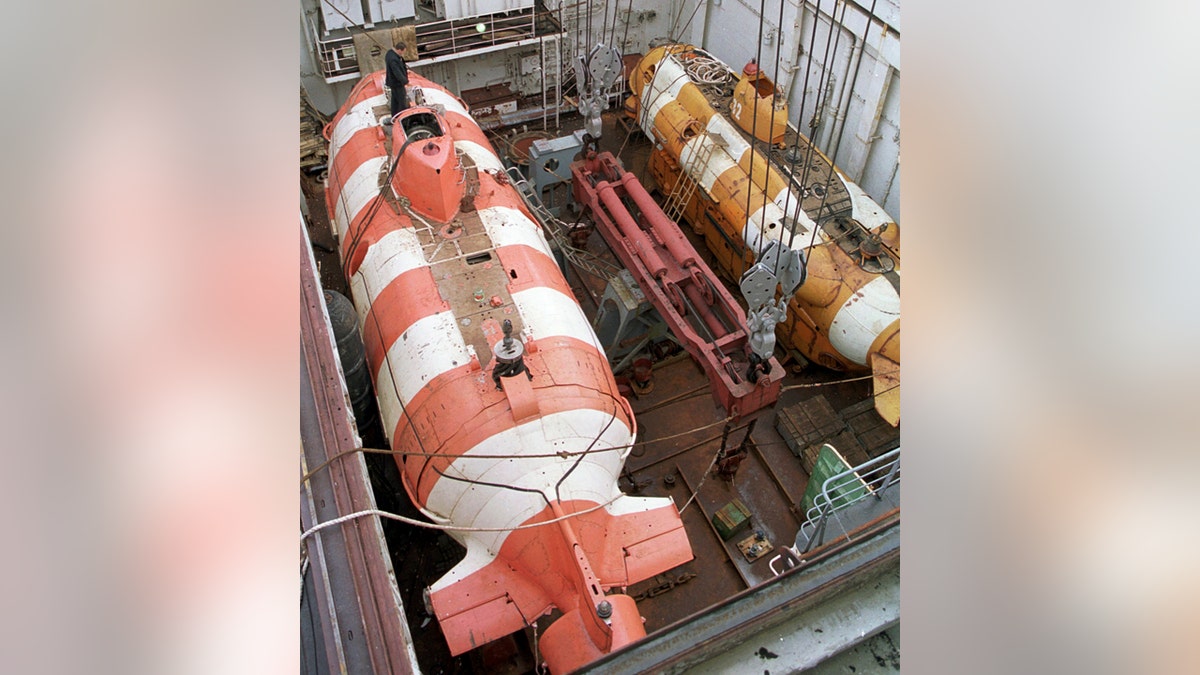 In this file photo taken on Friday, Aug. 5, 2005, a Russian mini rescue submarine, AS-34, called a Priz, left, is seen aboard the rescue ship Rudnetsky in the Barents Sea, Russia. (TASS News Agency via AP)