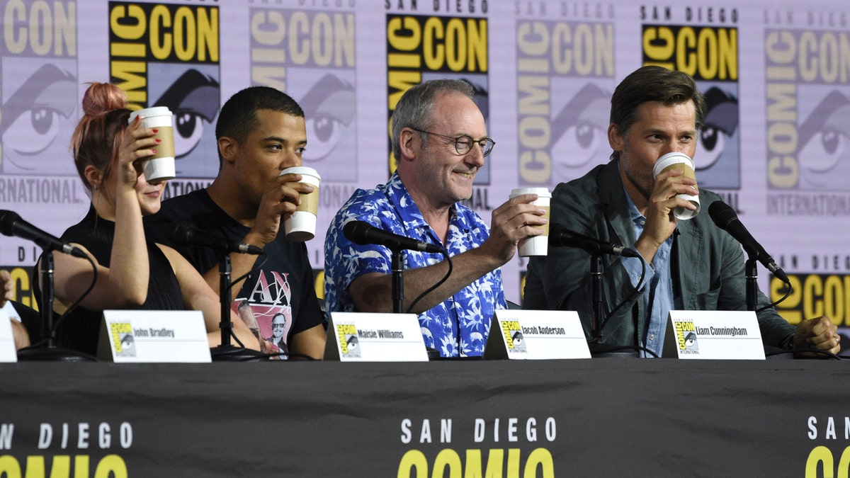 Maisie Williams, from left, Jacob Anderson, Liam Cunningham and Nikolaj Coster-Waldau appear at the "Game of Thrones" panel on day two of Comic-Con 