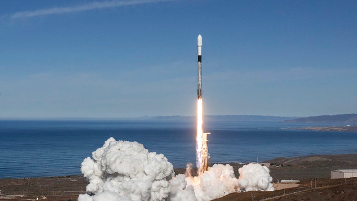 A SpaceX Falcon 9 rocket with a twice-flown first stage launches from Vandenberg Air Force Base in California on Dec. 3, 2018, carrying 64 satellites to orbit on the SSO-A: Smallsat Express mission.