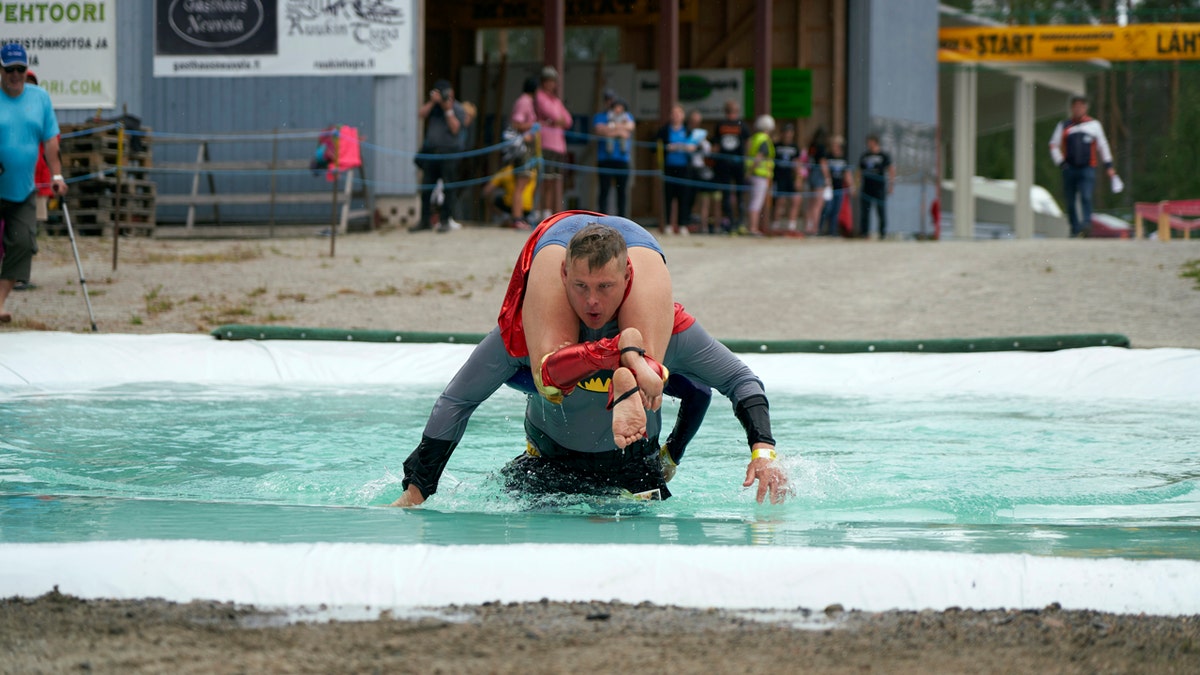 Despite the event's name couples don't have to be married, and organizers say male contestants could "steal a neighbor's wife" if they didn't have a female companion. (AP Photo/David Keyton)