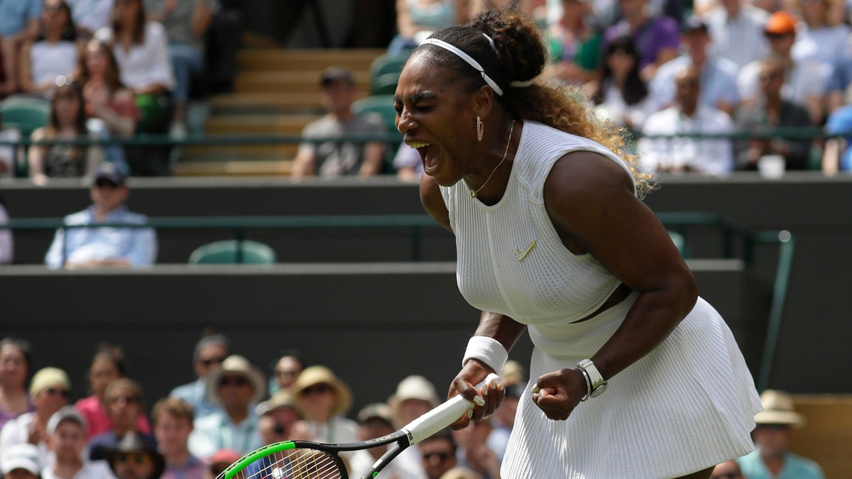 Serena Williams celebrates winning a point against Spain's Carla Suarez Navarro in a women's singles match during day seven of the Wimbledon Tennis Championships in London, July 8, 2019. (AP Photo/Kirsty Wigglesworth)