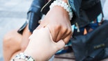 Two girls different races holding hands. Friendship concept.