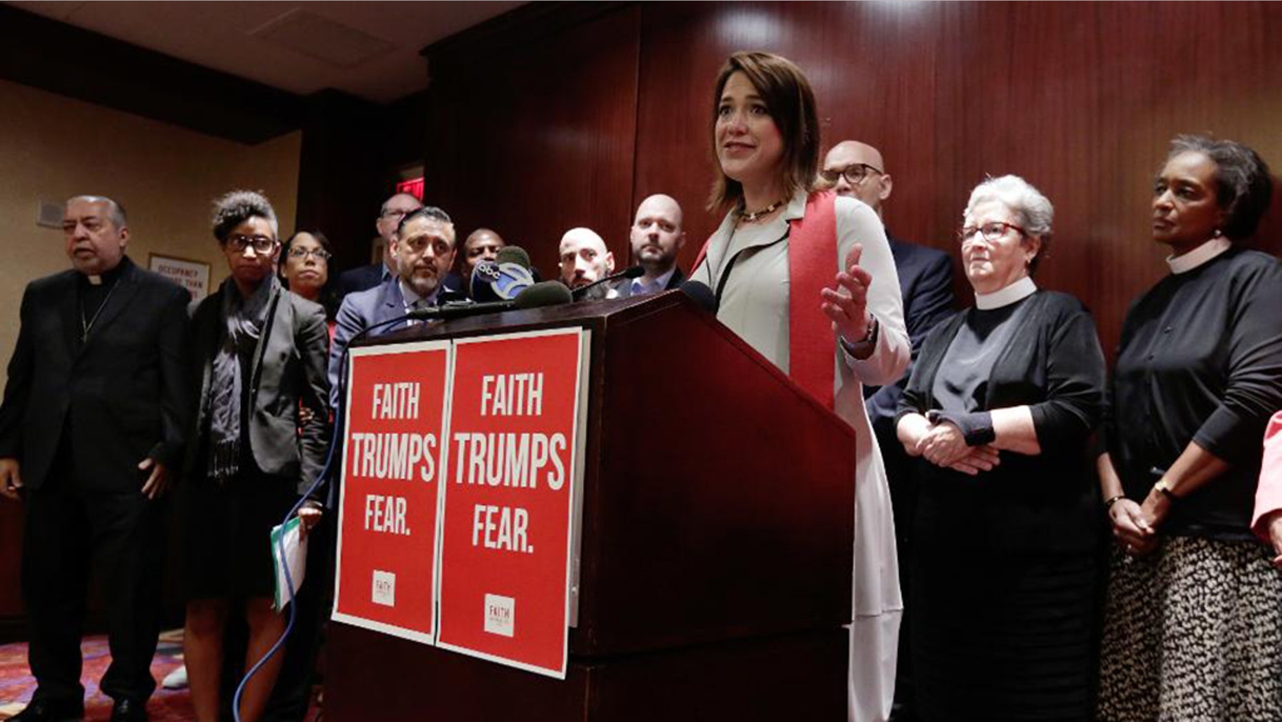 The Rev. Dr. Amy Butler, senior minister of The Riverside Church, speaks during a news conference in the hotel in New York's Times Square, Tuesday, June 21, 2016, where Republican presidential candidate Donald Trump is scheduled to meet evangelical clergy. A group of clergy gathered for a press conference to rebuke Trump's vitriolic, immoral rhetoric just ahead of his meeting with a group of conservative evangelical leaders in hopes of garnering their endorsement. (AP Photo/Richard Drew)