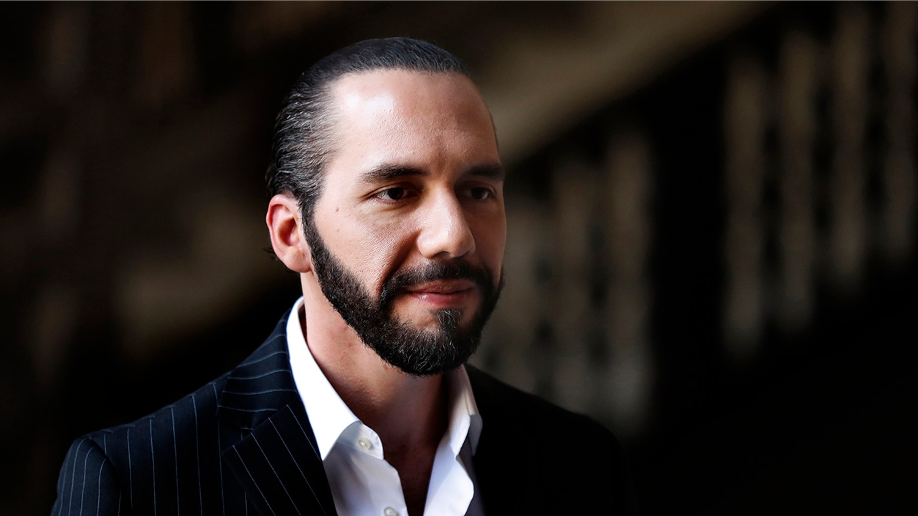 FILE - In this March 12, 2019 file photo, El Salvador's President-elect Nayib Bukele speaks to the press at Mexico's National Palace after meeting with the President Andres Manuel Lopez Obrador in Mexico City. (AP Photo/Marco Ugarte, File)