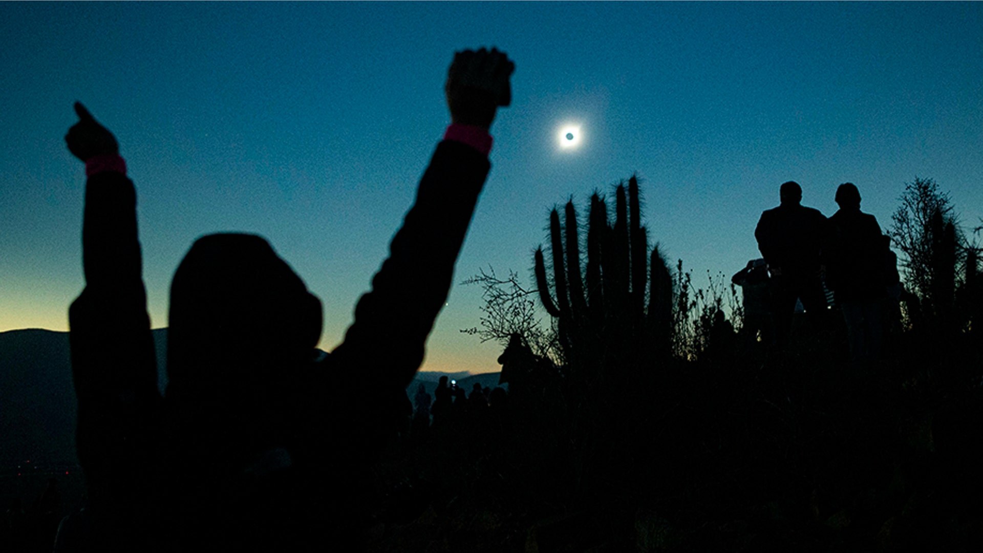 People view a total solar eclipse in La Higuera, Chile, July 2, 2019. 