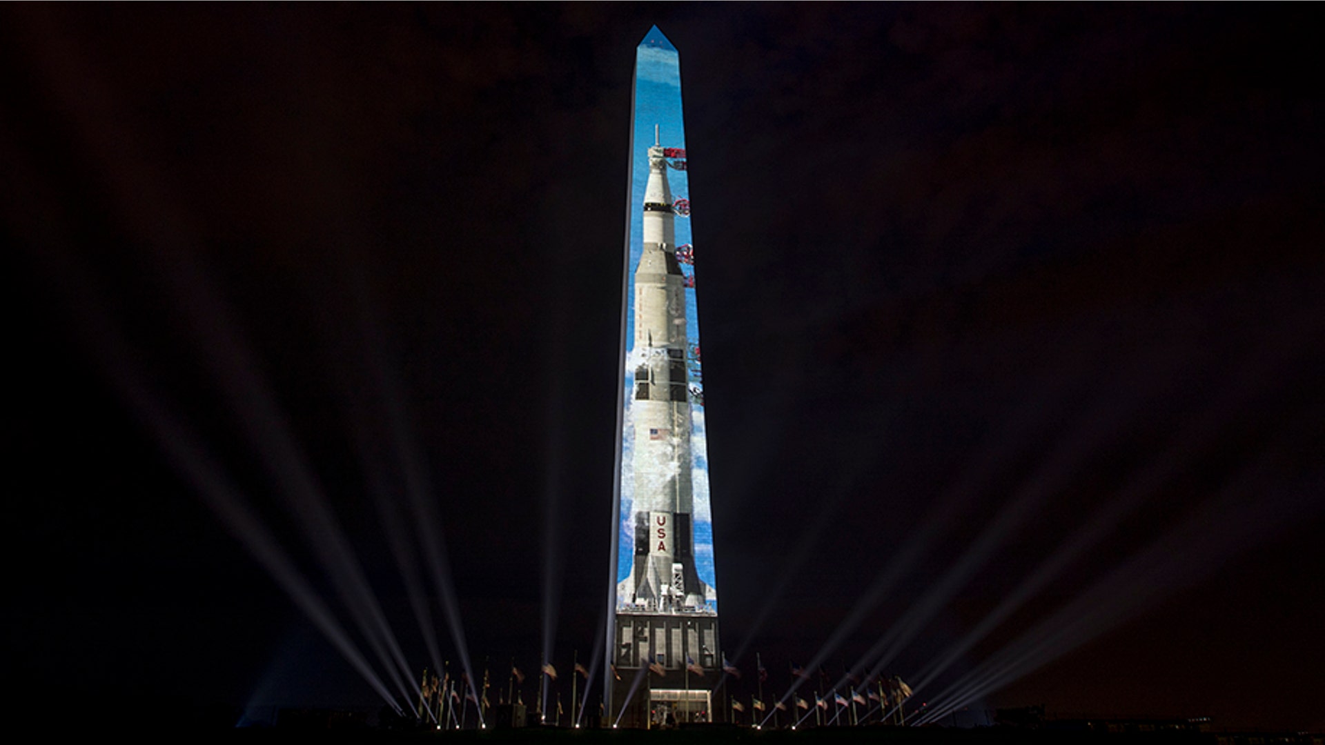 The image of a 363-foot Saturn V rocket is projected on the east face of the Washington Monument in Washington, July 17, 2019, in celebration of the 50th anniversary of the Apollo 11 moon landing.