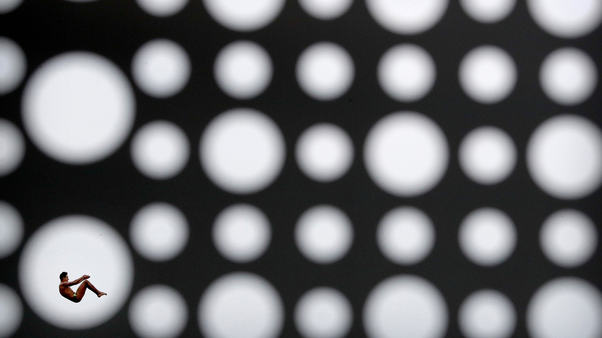 Viacheslav Kolesnikov of Ukraine dives during the men's high diving competition at the World Swimming Championships in Gwangju, South Korea, July 24, 2019. 