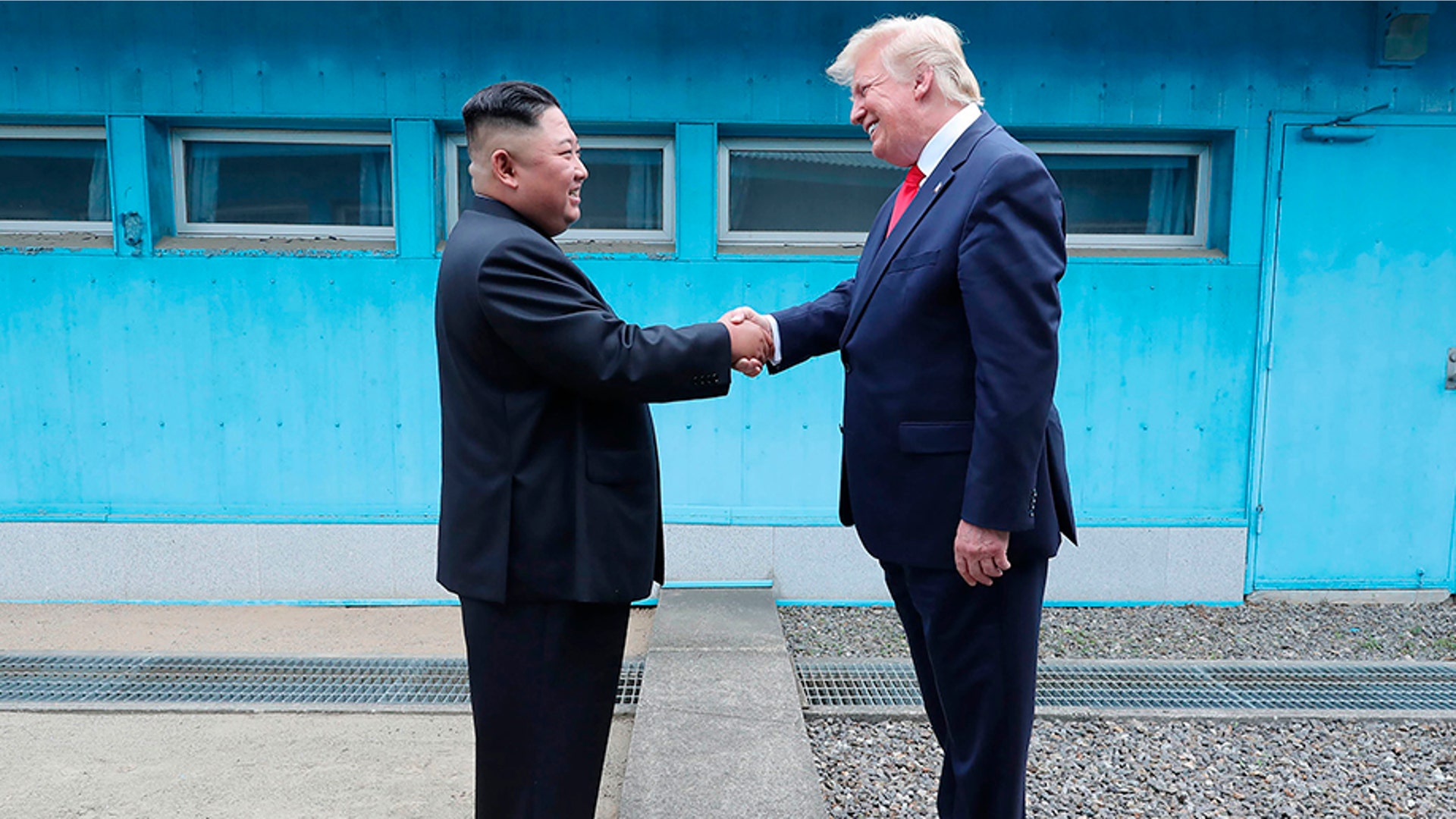 North Korean leader Kim Jong Un and President Donald Trump shake hands over the military demarcation line at the border village of Panmunjom in Demilitarized Zone, June 30, 2019. 