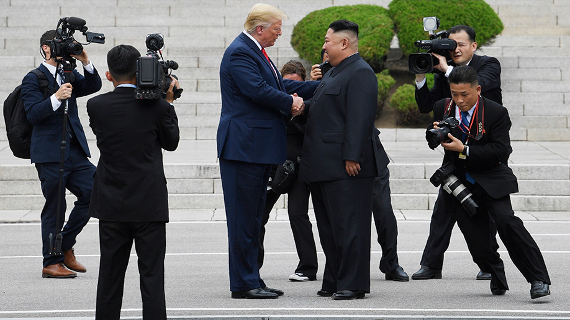President Donald Trump walks on the North Korean side of the border with North Korean leader Kim Jong Un at the border village of Panmunjom in the Demilitarized Zone, South Korea, June 30, 2019. 