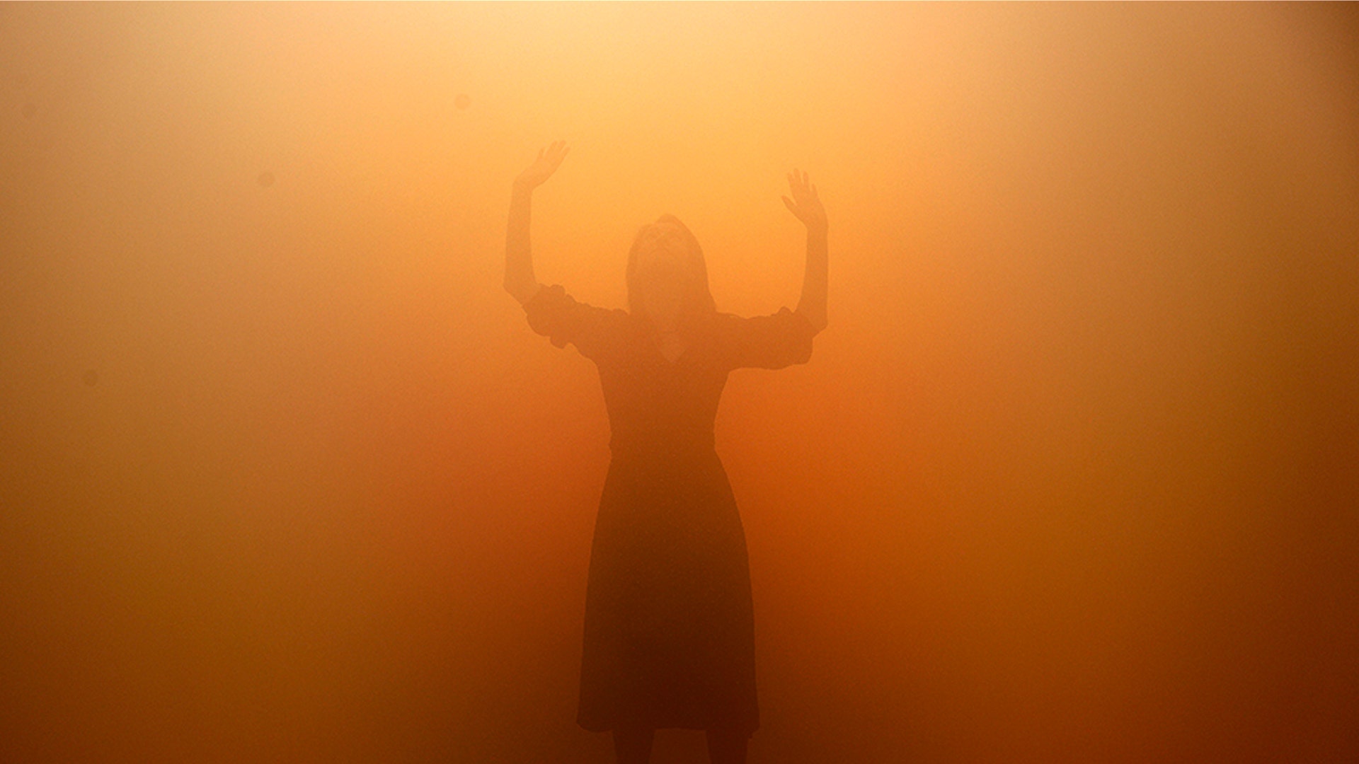 A visitor tries to walk through a room full of fog called 'Your Blind Passenger' as part of the exhibition Olafur Eliasson: 'In real life' at the Tate Modern Gallery in London, July 9, 2019. 