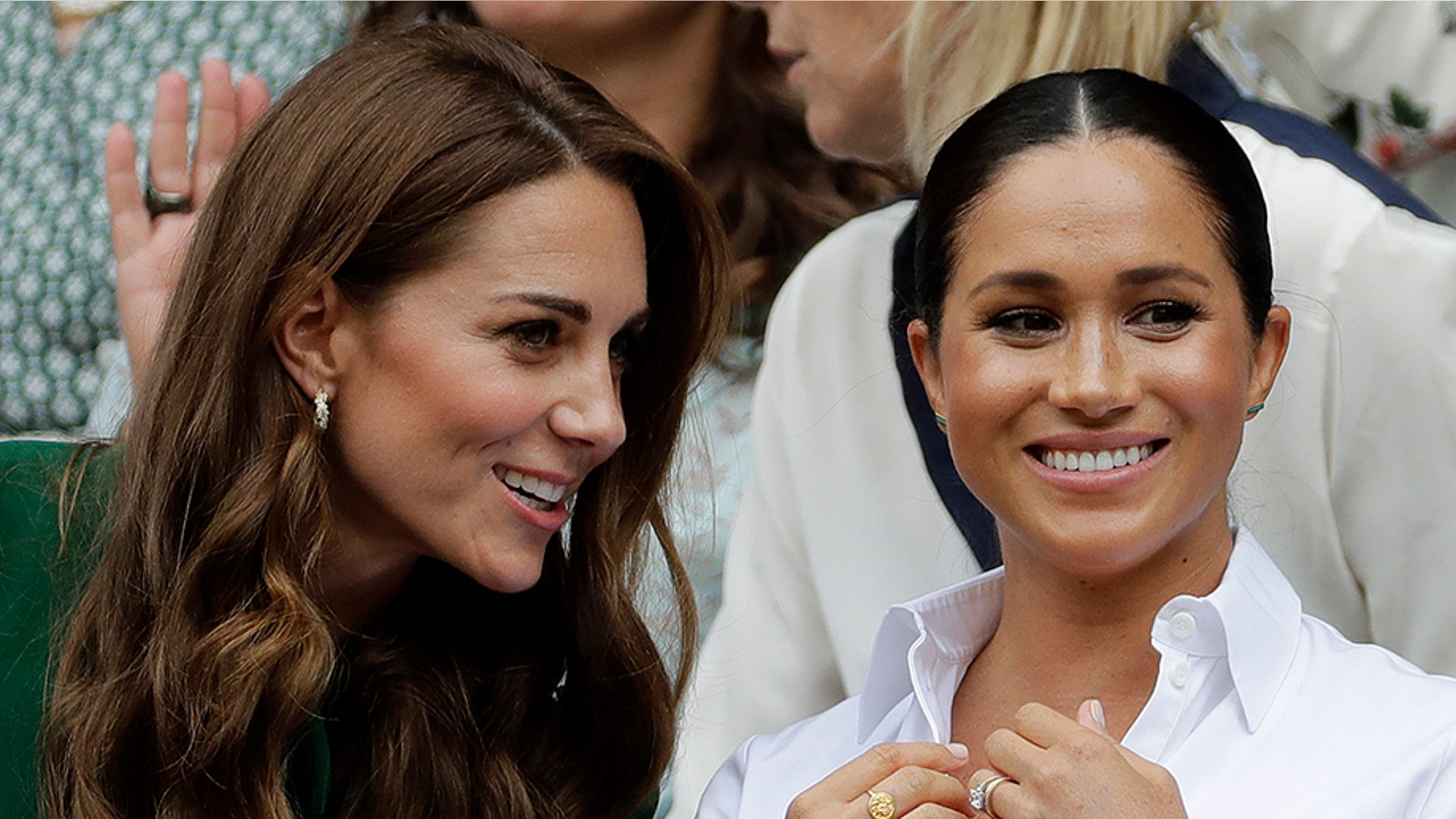 Kate, Duchess of Cambridge, and Meghan, Duchess of Sussex sit in the Royal Box to watch the women's singles final match at the Wimbledon Tennis Championships in London, July 13, 2019.