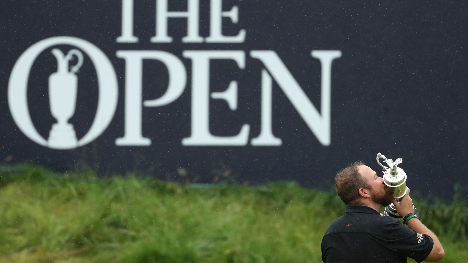 Ireland's Shane Lowry kisses the Claret Jug on the 18th green after winning the British Open Golf Championships at Royal Portrush in Northern Ireland, July 21, 2019.