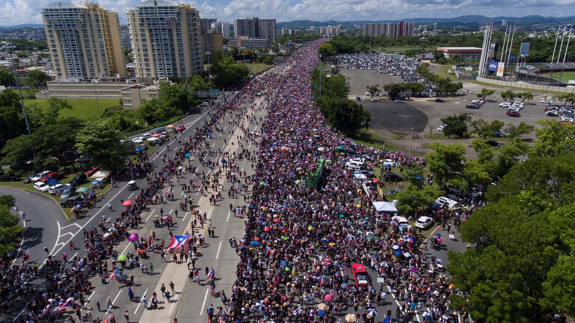 Demonstrators march on Las Americas highway demanding the resignation of Governor Ricardo Rossello, in San Juan, Puerto Rico, July 22, 2019. 