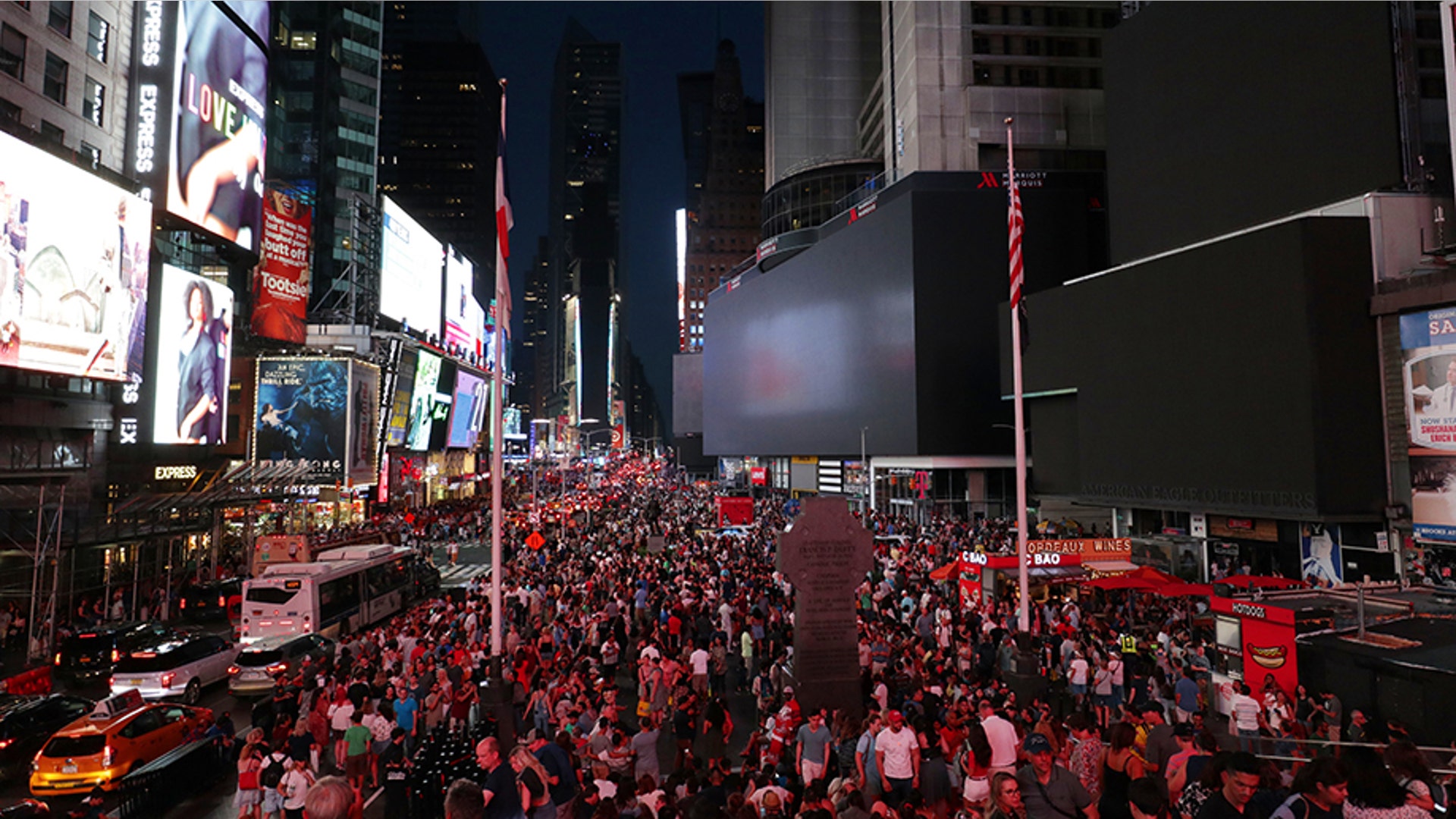 Advertising boards go dark in Times Square as a blackout hits parts of the west side of Manhattan in New York City, July 13, 2019.