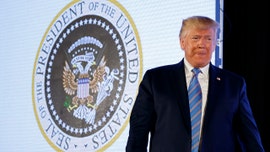 Aide fired after fake presidential seal displayed next to Trump at Turning Point USA event