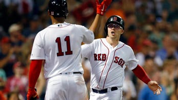 Massachusetts teens hailed for giving spare Red Sox ticket to homeless man