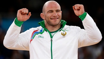 Olympic wrestler turned Russian politician stripped of second gold medal for doping
