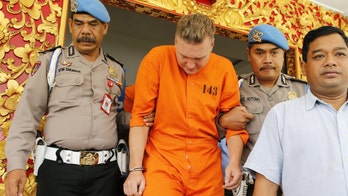 Shackled Australians paraded in front of cameras after drug arrests in Bali