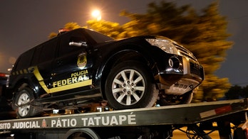 Armed men disguised as cops take $40M in gold, precious metals and hostages in Brazilian airport heist