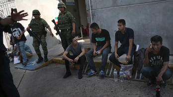 Border agents use tear gas to stop nearly 50 undocumented migrants who stormed Rio Grande bridge