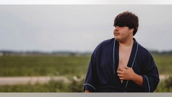 Teen's bathrobe-clad senior year photos go viral, though his mom is 'very unhappy' with pics