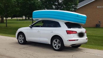 Mom caught cruising with 2 kids riding in an inflatable pool on top of her car