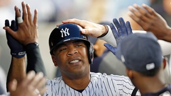 Teammates give Yankee slugger parrot in recognition of trademark trot after launching milestone homer