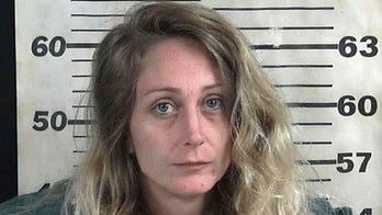 Woman accused of shooting husband while trying to shoot someone else in road rage incident