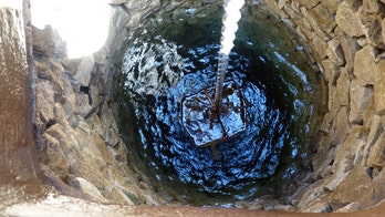 Teenager jumps in oil-filled well to rescue trapped cat