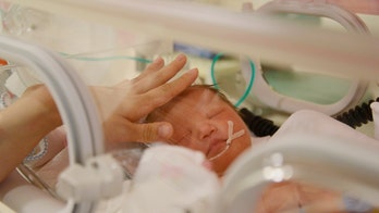 Mother of son with Down syndrome sues hospital, would've had abortion