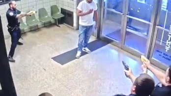 Video shows officers reacting to man who walked into NYPD station with knife and 'asked to be shot'