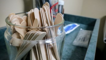 Woman films girl licking tongue depressor, putting it back in canister at Florida doctor's office