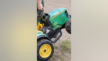 Missing Minnesota toddler found cruising on toy tractor at county fair