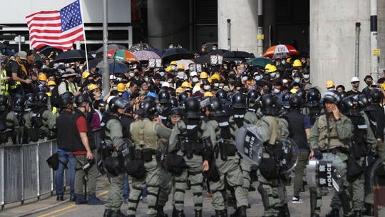 Hong Kong police fire tear gas at protesters