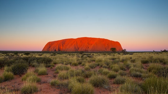 Tourists flock to Uluru before ban, straining sacred site