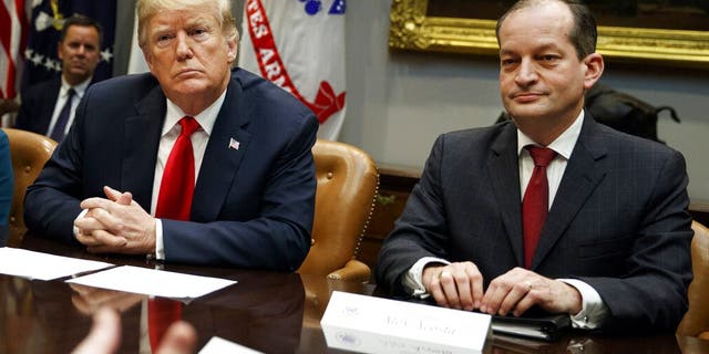 In this Sept. 17, 2018, photo, President Trump and Labor Secretary Alexander Acosta listen during a meeting of the President's National Council of the American Worker in Washington. (AP Photo/Evan Vucci, File)