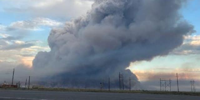 A fast-moving brush fire has prompted an evacuation of non-essential employees from the Idaho National Laboratory.