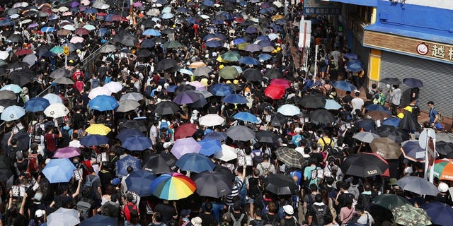 Protesters rally in Yuen Long in Hong Kong Saturday, July 27, 2019. Thousands of protesters began marching Saturday despite police warnings that their presence would spark confrontations with local residents. Demonstrators wearing black streamed through Yuen Long, the area where a mob brutally attacked people in a commuter rail station last Sunday.